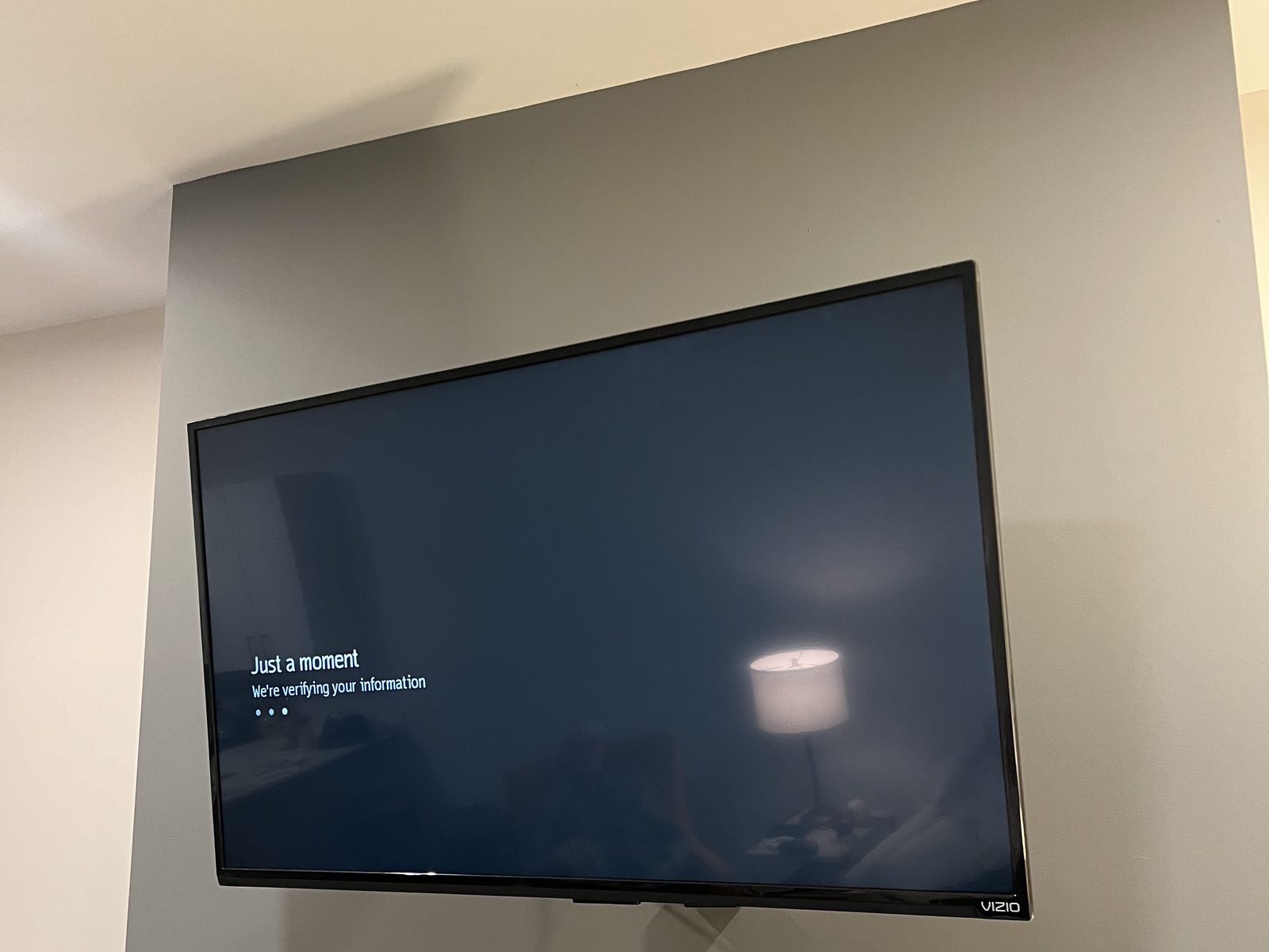 Flat-screen TV professionally wall mounted with concealed wiring in a home